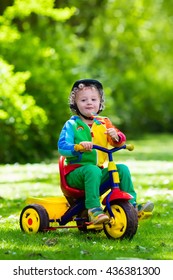 kid riding tricycle