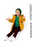 Cute boy in winter jacket having fun