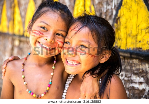 Cute Brazilian\
indians paying in Amazon,\
Brazil
