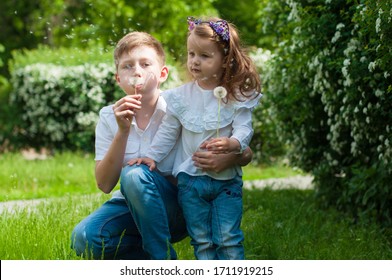 Cute Brother And Sister Play Together In Summer Park