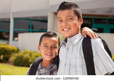 Cute Brothers Wearing Backpacks Ready for School.