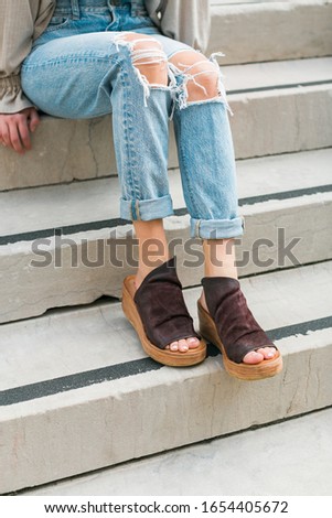 Cute brown leather and wood platform wedges on model
