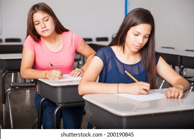 Cute Brunette Trying To Cheat During A Test In High School