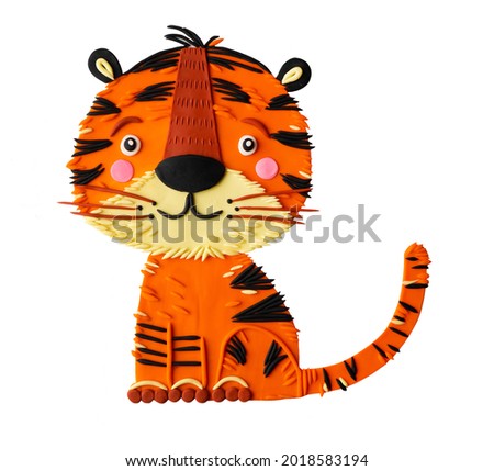Cute cartoon plasticine clay tiger cub hand made childish craft. Chinese asian predator symbol of the year. Safari African striped wild cat.