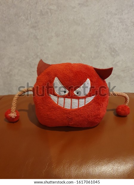 Cute cartoon red\
devil phone holder\
equipment