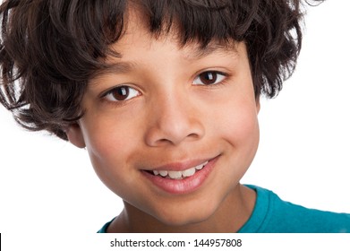 Cute casual mixed race afro caribbean boy standing isolated in studio white background.