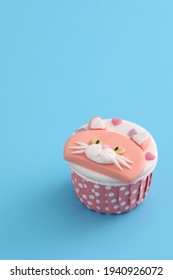 Cute Cat Cupcake Isolated In Blue Background