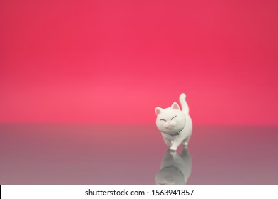 Cute Cat Or Kitten Figure Walking Isolated In Pink Background. Animal Lover Or Quotes Concept.