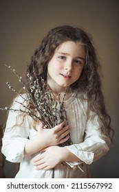 Cute Caucasian Child Girl With Spring Bouquet Of Willow. Easter And Palm Sunday.