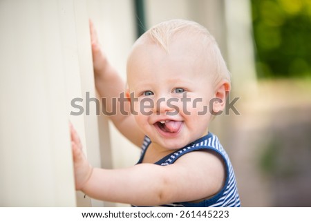 Cute Cheeky Baby Boy Sticks His Stock Photo (Edit Now) 261445223 ...