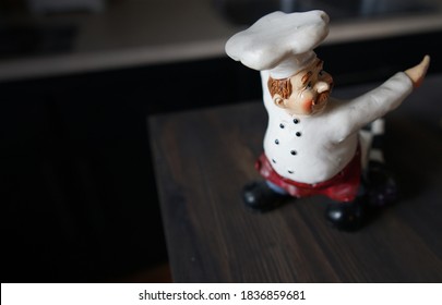                  Cute chef statue in a kitchen