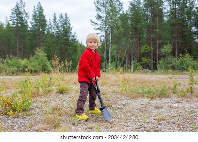 Cute Child, Digging A Hole, Cleaning After Himself On A Wild Camping In The Forest