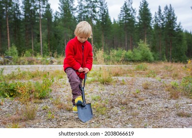 Cute Child, Digging A Hole, Cleaning After Himself On A Wild Camping In The Forest