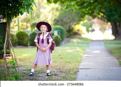 Cute Child, Happy Little School Girl, Pupil Of Primary School In Australia, Standing Outdoors Near Pathway, Ready To Go To School For The First Time