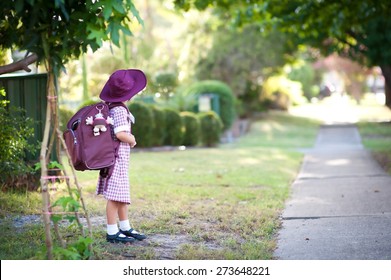 Cute Child, Happy Little School Girl, Pupil Of Primary School In Australia, Standing Outdoors Near Pathway, Ready To Go To School For The First Time