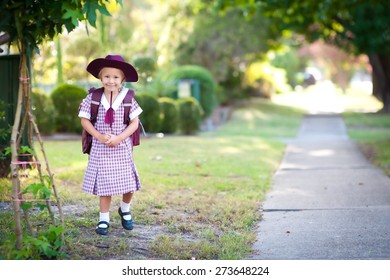 Cute Child, Happy Little School Girl, Pupil Of Primary School In Australia, Standing Outdoors Near Pathway, Ready To Go To School For The First Time