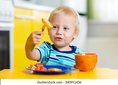 Cute Child Little Boy Eating Food Stock Photo (Edit Now) 340951436