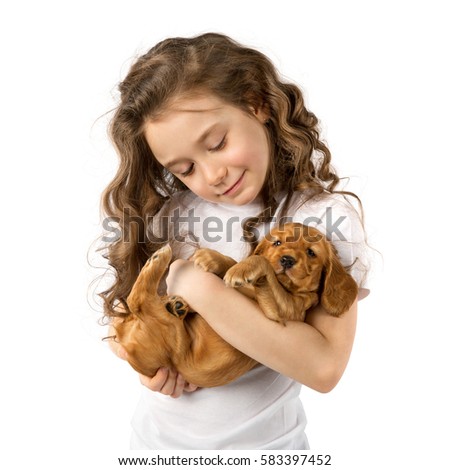 Cute child little girl with red puppy isolated on white background. Kid pet friendship