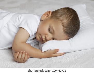 Cute Child Is Sleeping In Bed