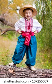 Cute Child In Traditional Eastern European Clothes Outdoor