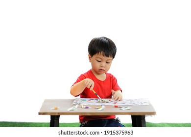 cute  children drawing with paintbrush and colorful paints