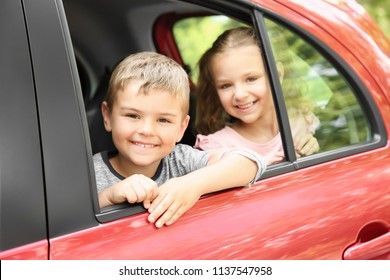 Cute Children On Back Seat Of Car. Family Trip