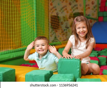 Cute children playing in entertainment center - Shutterstock ID 1136956241