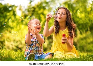 Cute children are playing in  park - Powered by Shutterstock