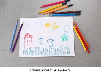 Cute child`s drawing and colorful pencils on grey textured table, flat lay - Powered by Shutterstock