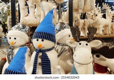 Cute Christmas Snowman Family with Reindeer in the Store                             - Powered by Shutterstock