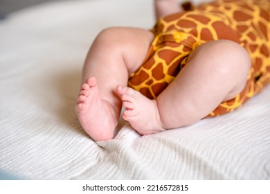 Cute Chubby Baby Legs On A White Sheet