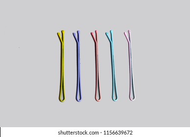 Cute Colorful Hair Pin of Hair Accessories. Bobby Pin from The 90s. Colored Metal Hair Clips Isolated on Gray Background Great For Any Use.