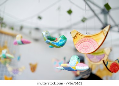 Cute colorful wooden birds sold on Easter market in Vilnius. Lithuanian capital's annual traditional crafts fair is held every March on Old Town streets.