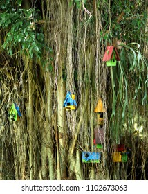 cute colourfull birds house at a big tree - Shutterstock ID 1102673063