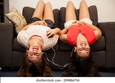 Cute Couple Of Best Teenage Friends Listening To Music At Home And Acting Silly