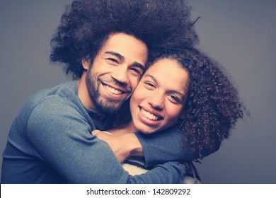 Cute couple both with an afro posing