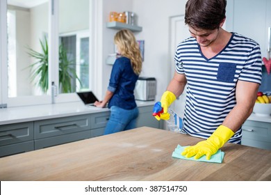Cute Couple Cleaning Up The Kitchen