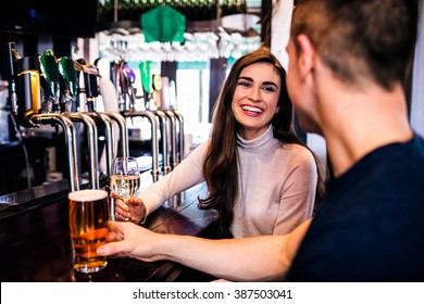 Cute couple having a drink in a bar