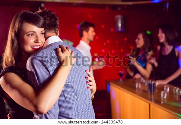 Cute couple\
slow dancing together at the\
nightclub