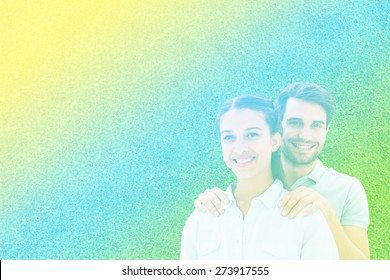 Cute Couple Smiling At Camera Against Astro Turf Surface