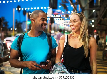 Cute Couple Walking Through Santa Monica At Night