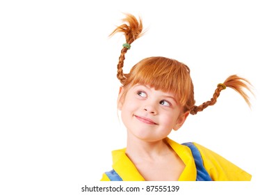 Cute cunning little girl with red braided hair