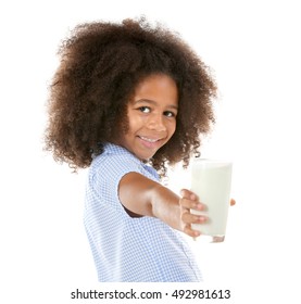 Cute curly African-American girl drinking milk on a white background