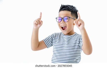 Cute cutout portrait of pretty smart young healthy Asian boy wearing glasses and horizontal striped shirt happily raising hands and index fingers up with smile and shout out loud for signal sending - Powered by Shutterstock