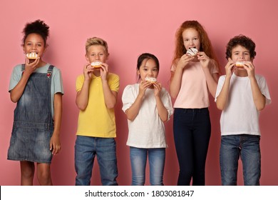 Cute Diverse Children Eating Yummy Donuts Against Pink Background