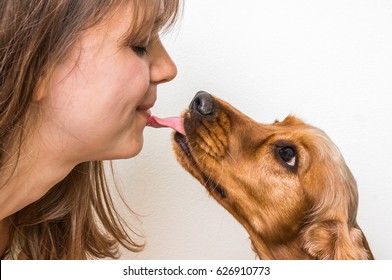 Cute Dog Licking Face Of Woman - True Friend Concept