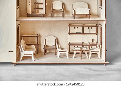 Cute Doll House With Toy Furniture Made Of Plywood Details Cut With Laser Machine Tool Stands With Open Wall On Light Grey Closeup