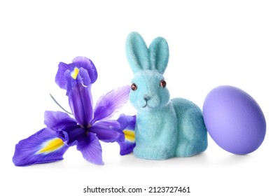 Cute Easter bunny with painted egg and flower on white background