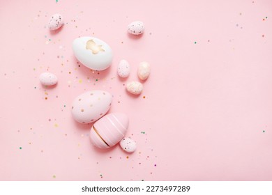 cute easter composition. painted eggs, confetti on a pastel pink background. top view. copy space. flat lay. place for text - Powered by Shutterstock - Get 15% off with code: PIKWIZARD15