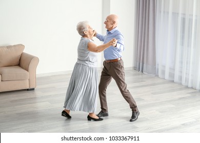 Cute Elderly Couple Dancing At Home